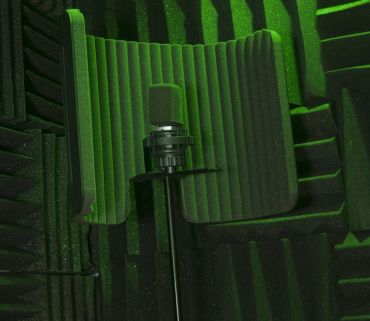 a microphone ready to record in a portable vocal isolation booth